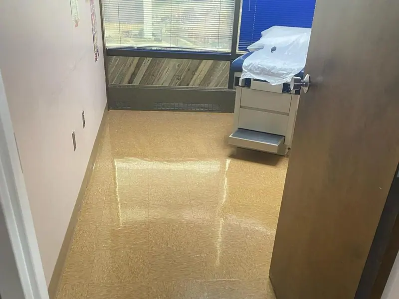 Floor waxing in Rhode Island - glossy clinic exam room floor