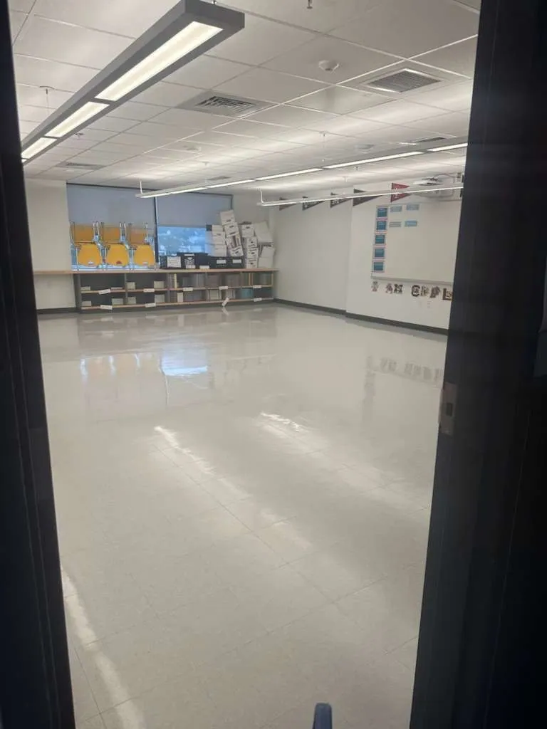 Glossy classroom floor reflecting the ceiling lights