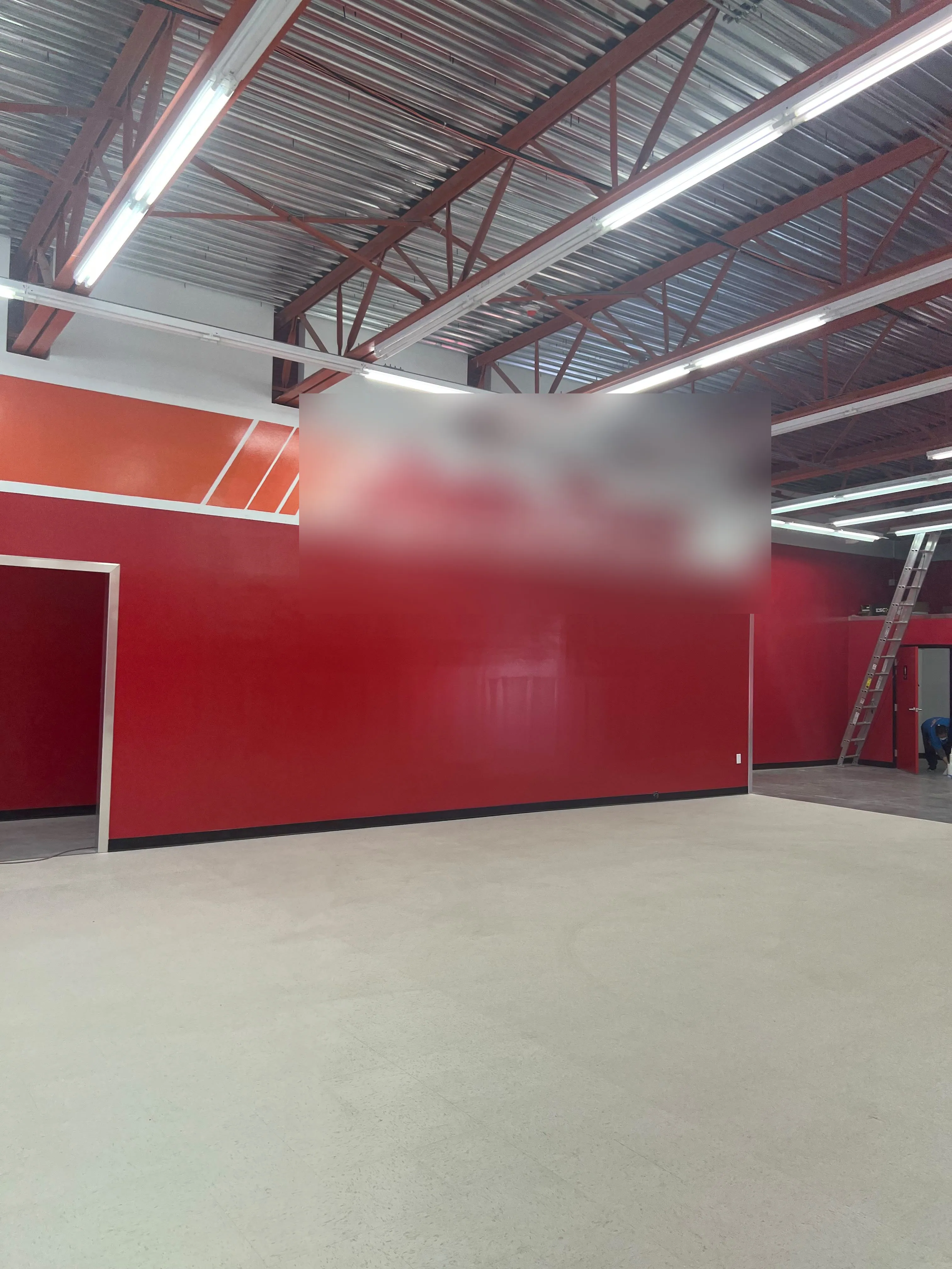 Large retail store floor under a high steel-beam ceiling