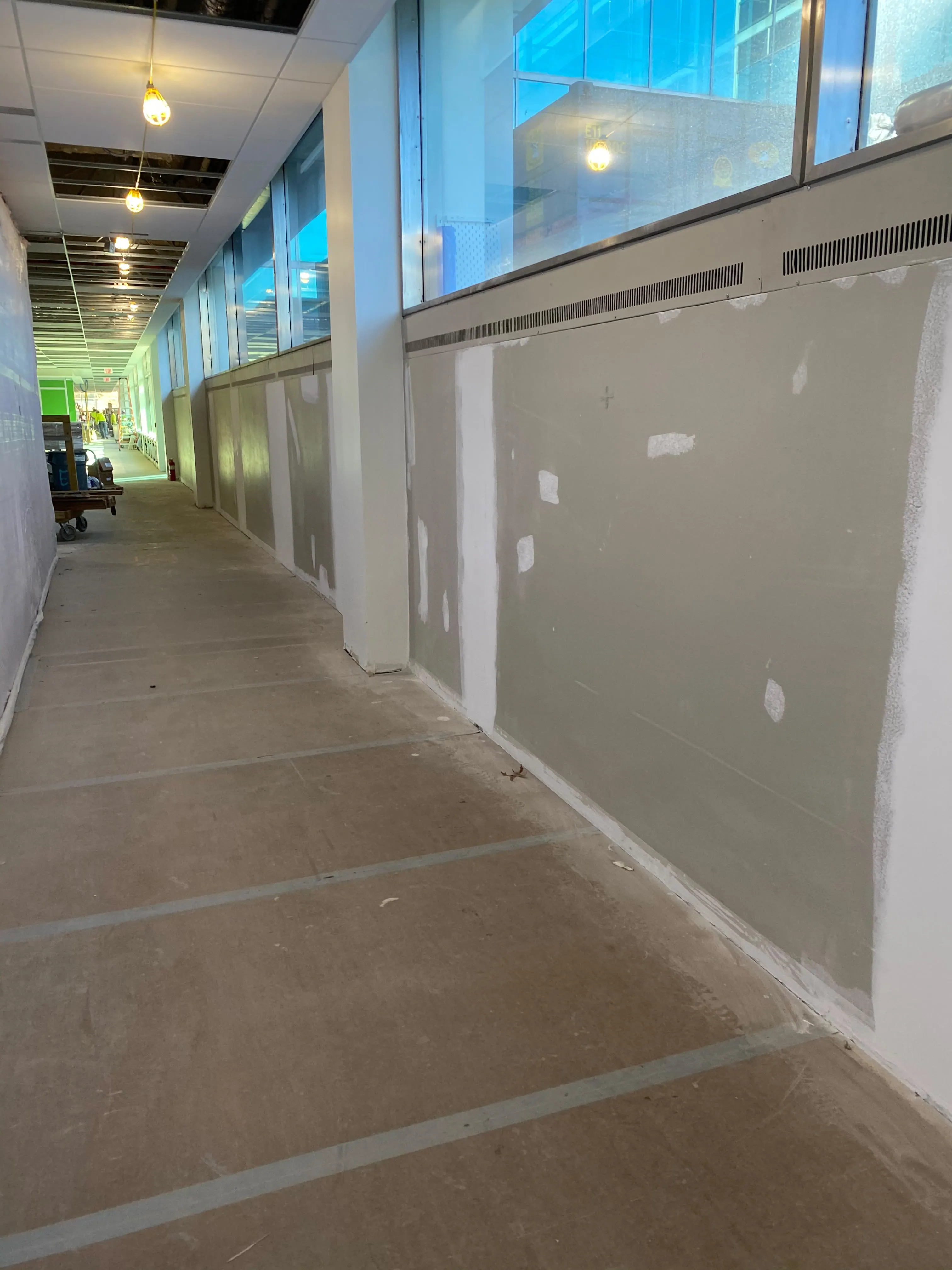 Corridor with protected floor and prepared walls