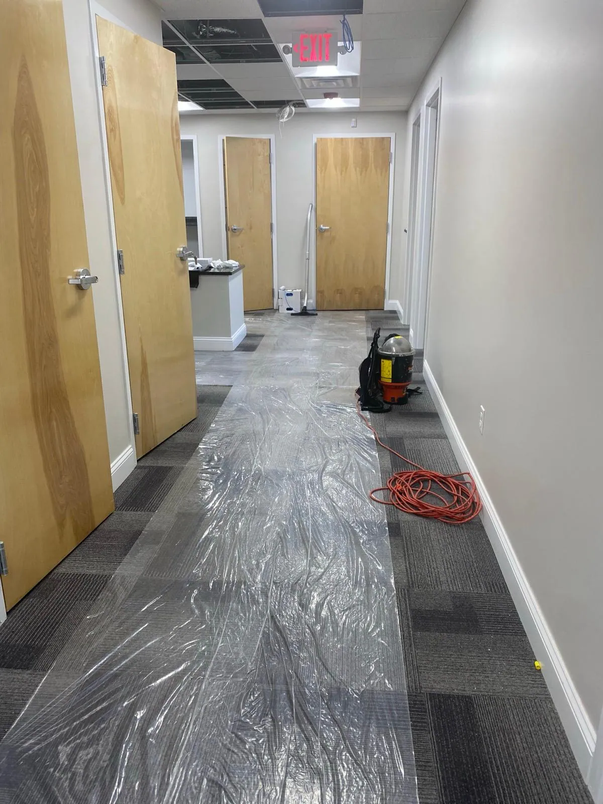 Office corridor with the carpet protected during work